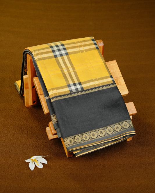 Yellow colour soft silk saree with contrast Black border.