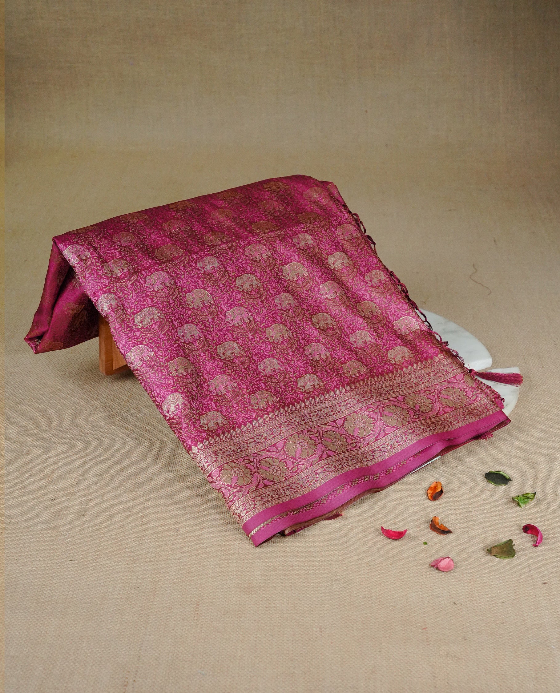 Deep purple colour Mulberry silk saree featuring gold zari elephant & floral kodi pattern across body, complemented by self colour border with gold zari work, comes with matching blouse piece.
