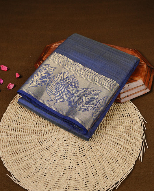 Navy Blue colour semi tussar silk saree featuring elegant plain body, highlighting self colour with traditional border, paired with matching blouse piece.