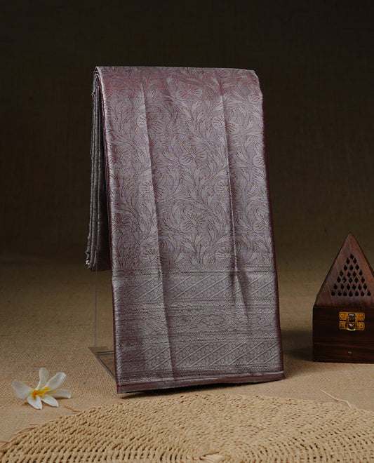 Silver & Maroon colour Tissue silk saree featuring Maroon & Silver zari kodi pattern on body, enhanced with Zari border on self colour, paired with matching Blouse piece.