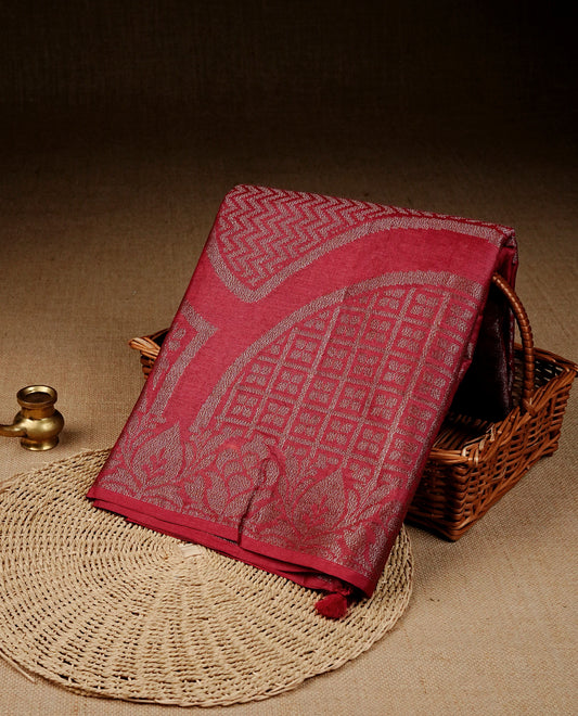 Red colour banaras saree featuring Antique zari kodi pattern on body, complemented by Zari pattern on self colour border, comes with matching blouse piece.