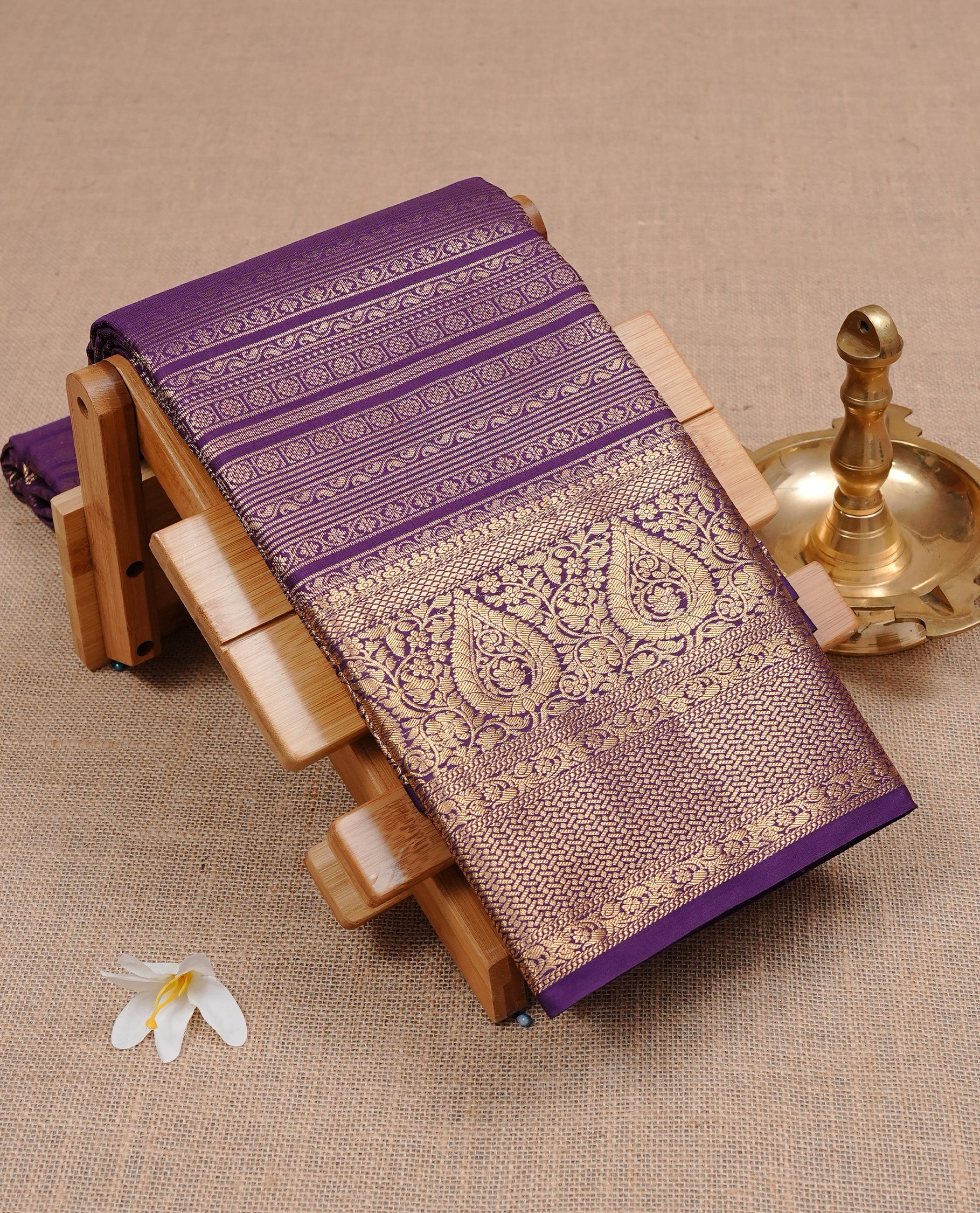 Purple colour Semi wedding silk saree featuring strip pattern on body, complemented by self colour traditional border, paired with matching blouse piece.