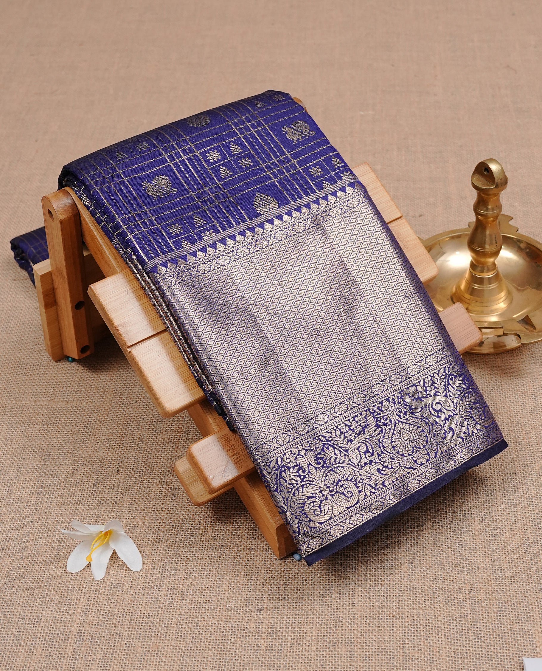 Navy Blue Wedding Silk Saree featuring Gold Zari Check with Motifs On body, Complemented with traditional zari with Self colour border, paired with matching blouse piece.