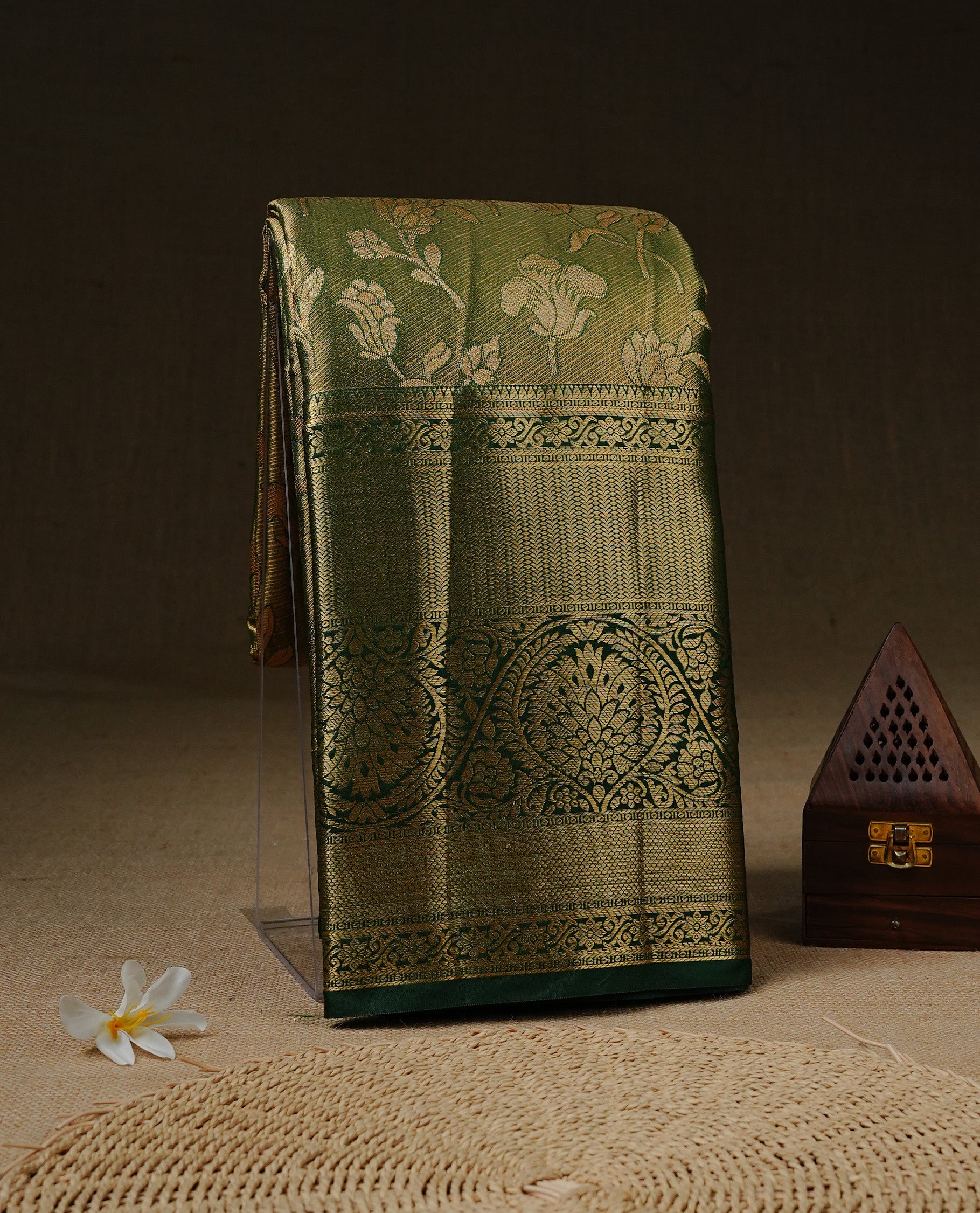 Green & Gold double shade Tissue saree featuring gold Zari pattern on body, complemented by traditional border on self colour, paired with matching blouse piece.