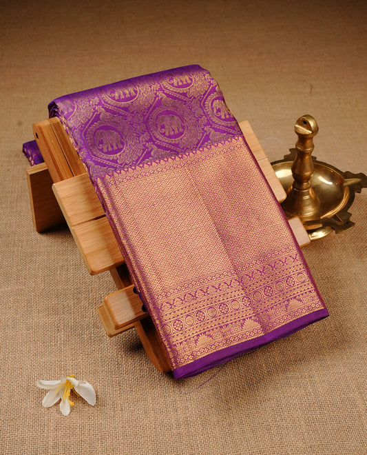 Violet Colour Pure Kancheepuram Silk Saree Featuring Gold Zari Elephant and Peacock In a Circle  Pattern on the Body, Highlighting a Traditional Gold Zari Border, Paired with a Matching Blouse Piece.