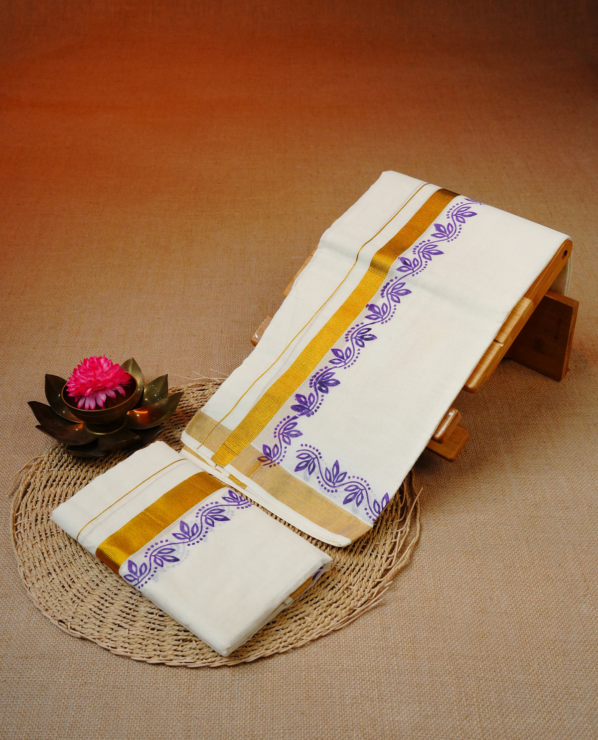 Cream colour cotton set mundu featuring gold kasav kara with purple kodi print