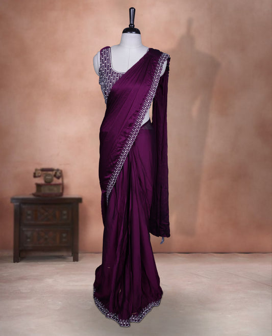 Elegant Grape colour ready to wear saree adorned with rich white stone and bead embroidery along the border and pallu, paired with a heavily embellished matching blouse for a grand festive look.