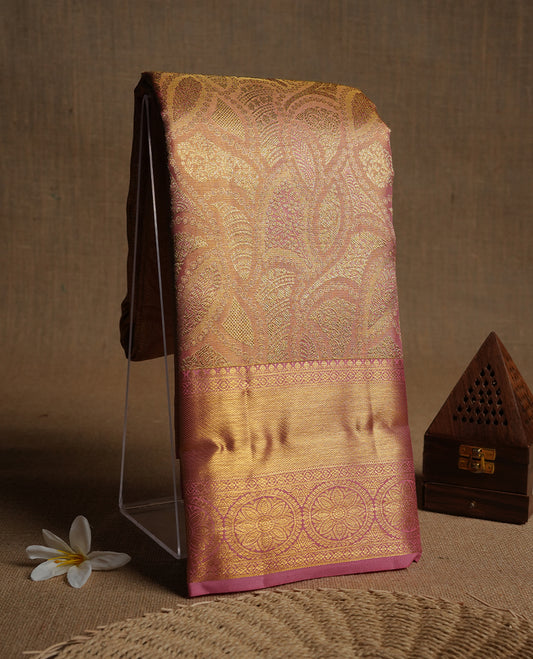Pink & gold double shade colour kancheepuram tissue silk saree highlighting gold zari pattern body, with contrast Pink colour colour with traditional border and paired with matching blouse.