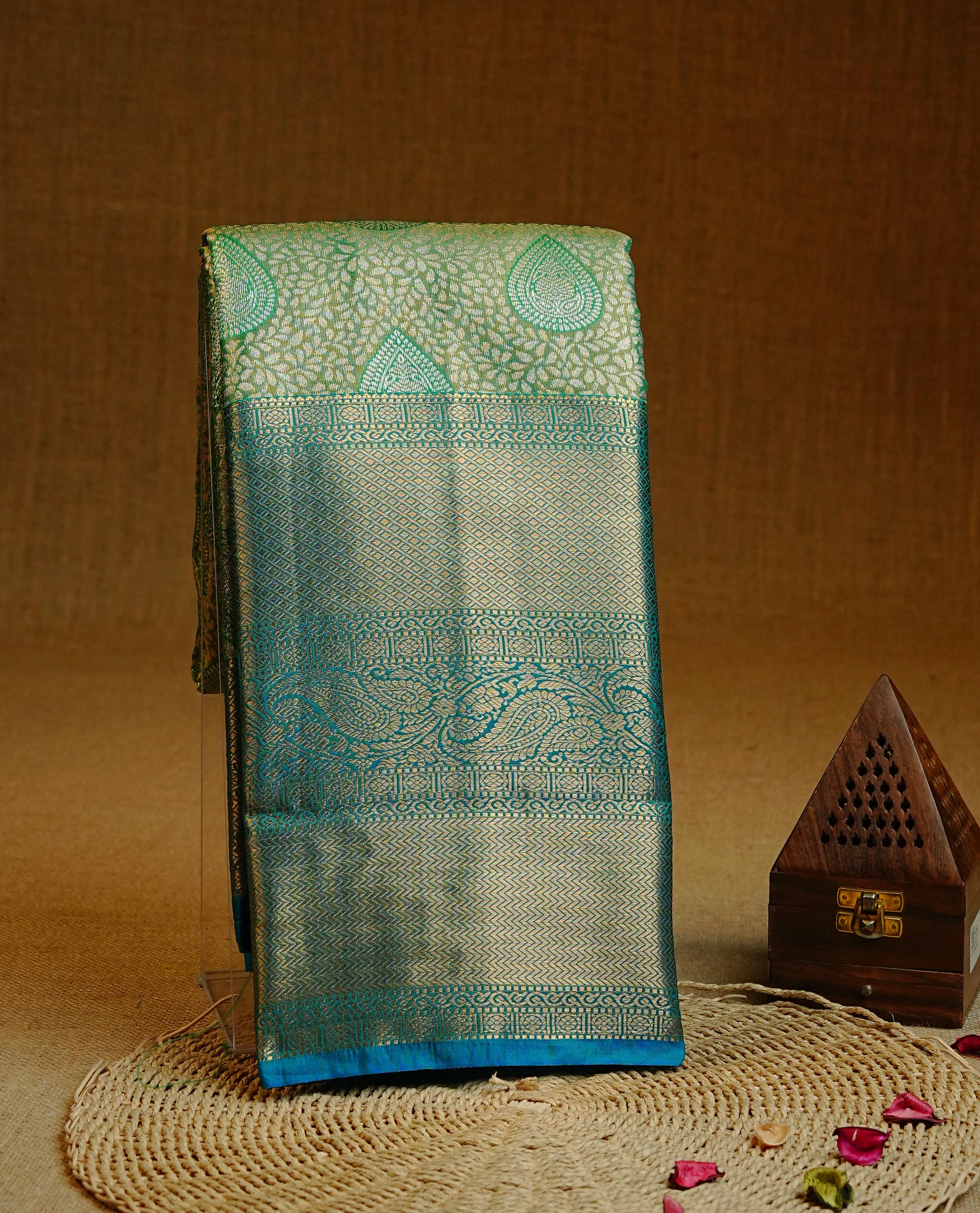 Green & Gold Double shade Semi Tissue Silk saree featuring Light gold pattern on body, complemented by Contrast Blue with gold zari border, paired with matching blouse piece.