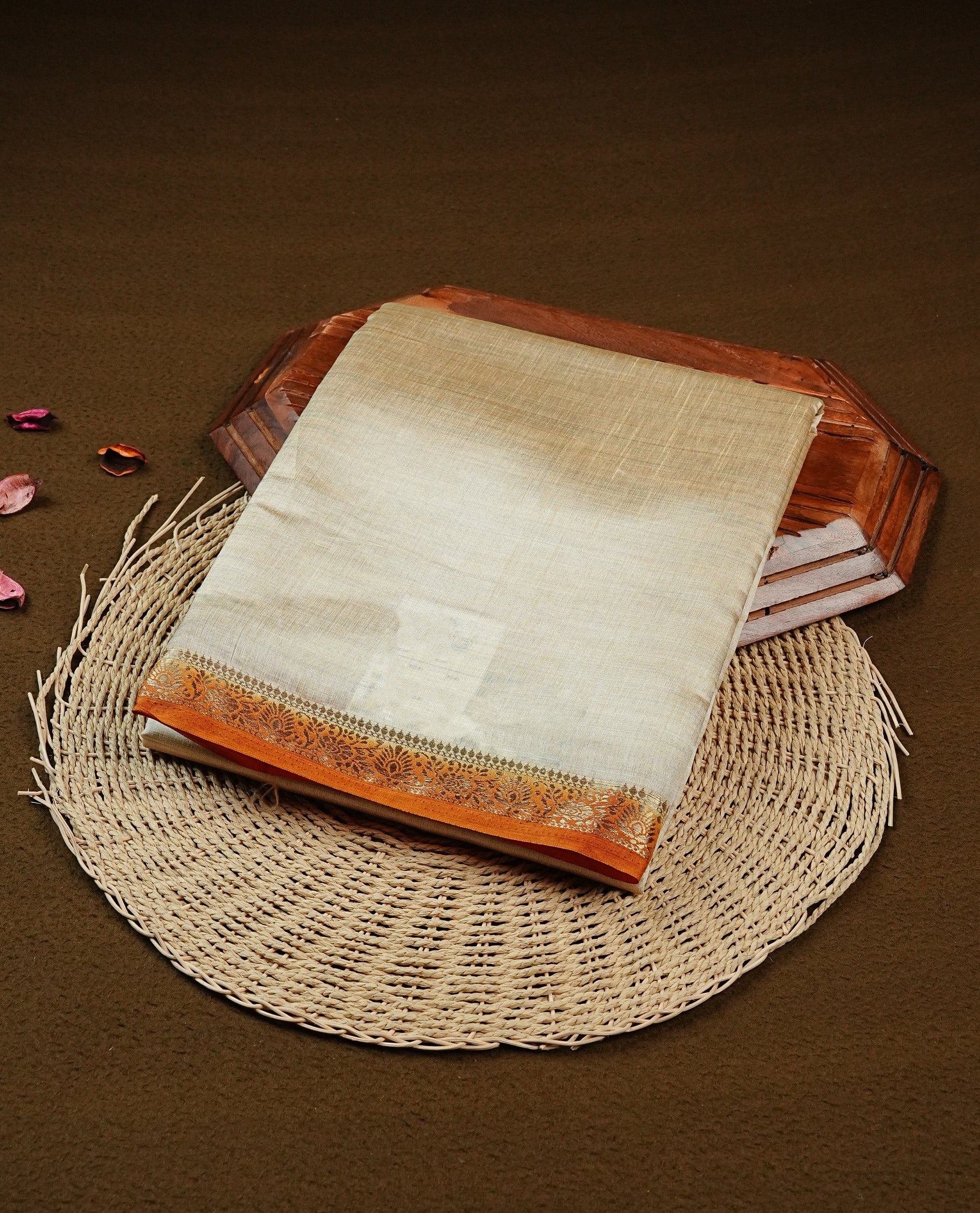 Light gold Colour Tussar saree featuring elegant plain body, complemented by contrast Mustard colour with zari work border, comes with matching blouse piece.