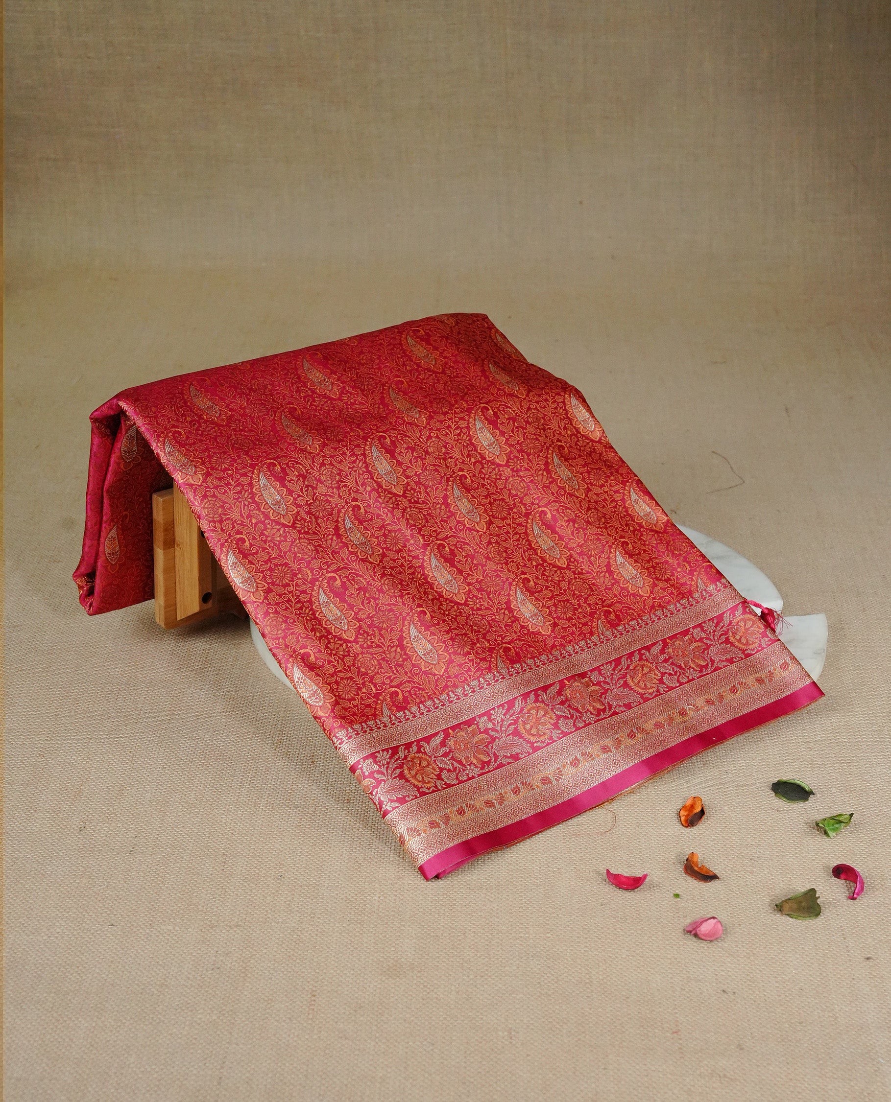 Rani pink colour Mulberry silk saree featuring gold zari Mango & floral kodi pattern across body, complemented by self colour border with gold zari work, comes with matching blouse piece.