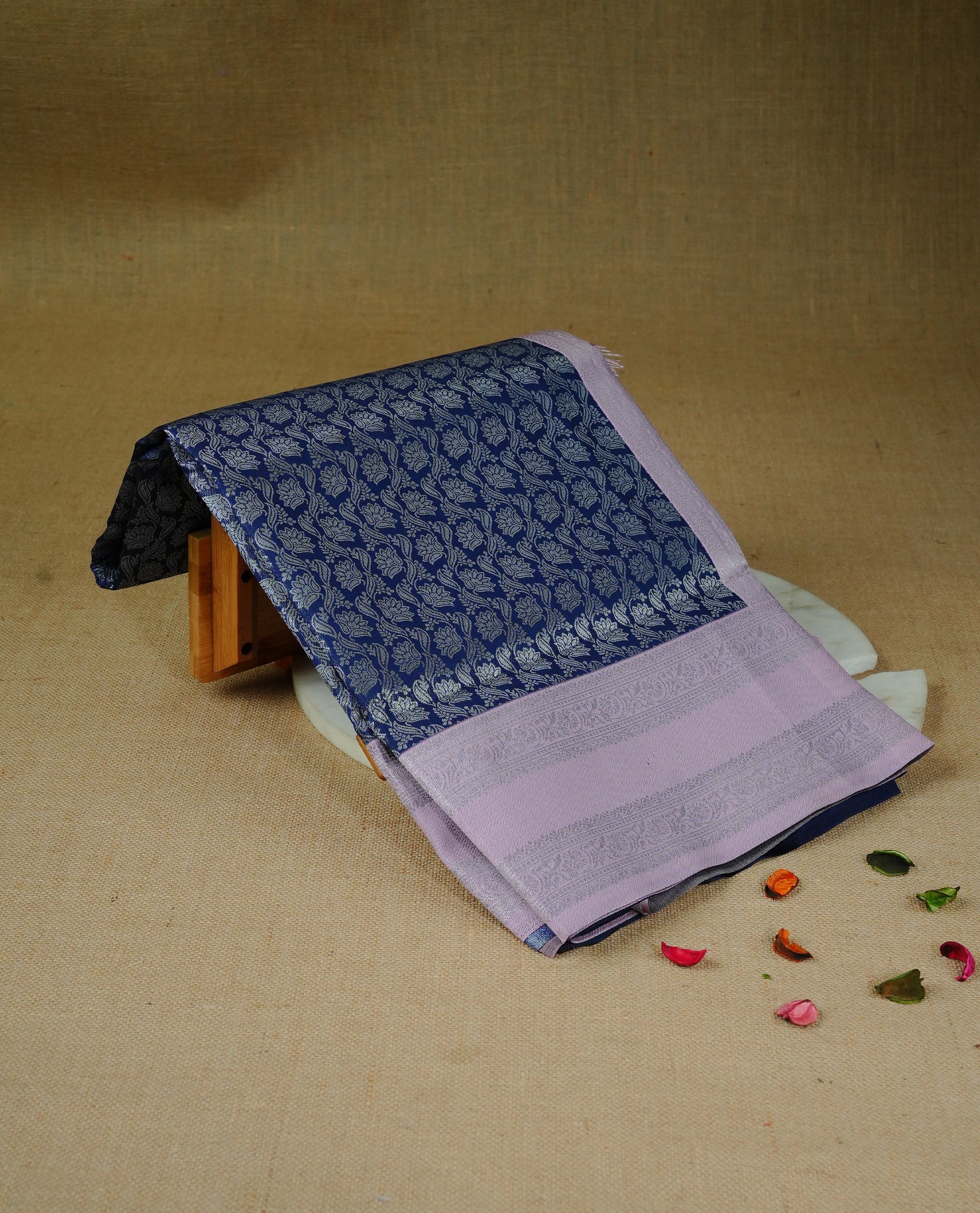 Navy Blue colour semi silk saree featuring Silver zari floral pattern on body, complemented by contrast Pink colour with silver zari border, comes with matching blouse piece.
