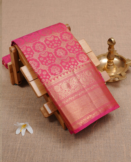 Magenta colour semi wedding silk saree featuring motifs with box pattern on body, complemented by self colour with traditional border, paired with matching blouse piece.