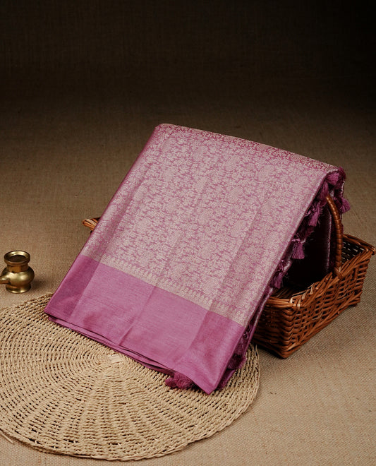 Pastel pink Colour banaras saree featuring Light gold zari Floral kodi pattern on body, complemented by borderless finish, comes with matching blouse piece.