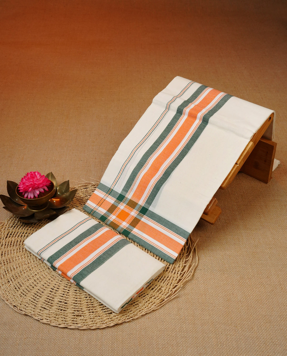 Cream colour cotton set mundu featuring Green & Orange kara.