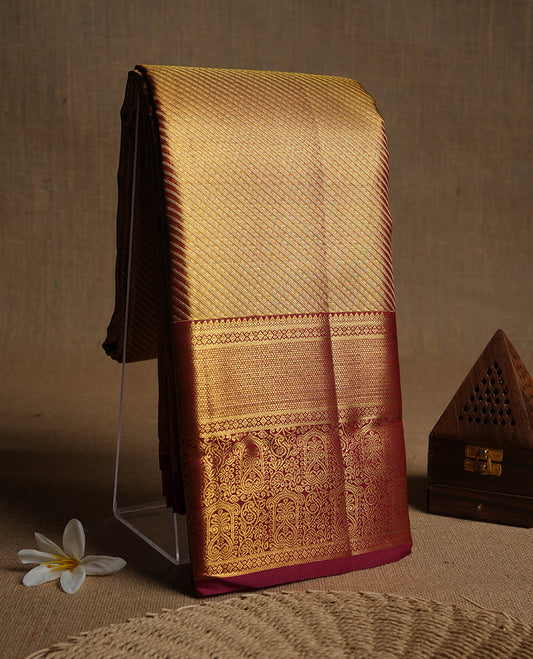 Red & gold double shade colour kancheepuram tissue silk saree highlighting gold stripped  zari pattern body, with contrast burgundy colour colour with traditional border and paired with matching blouse.