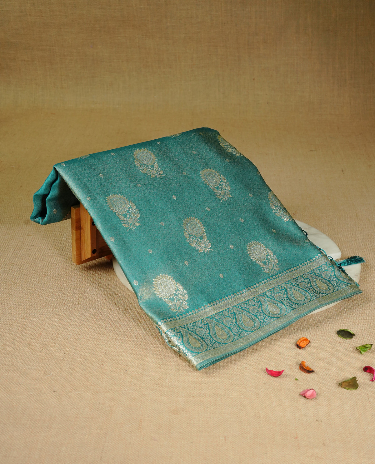 Teal colour Mulberry silk saree featuring Gold zari small buttas & floral motifs  on body, complemented by self colour with Gold zari border, comes with matching blouse piece.