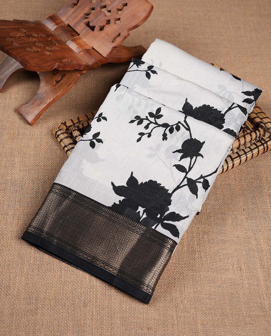 Off White colour Viscos semi printed saree featuring a light golden zari border, abstract black printed motifs on the body, and comes with a matching blouse