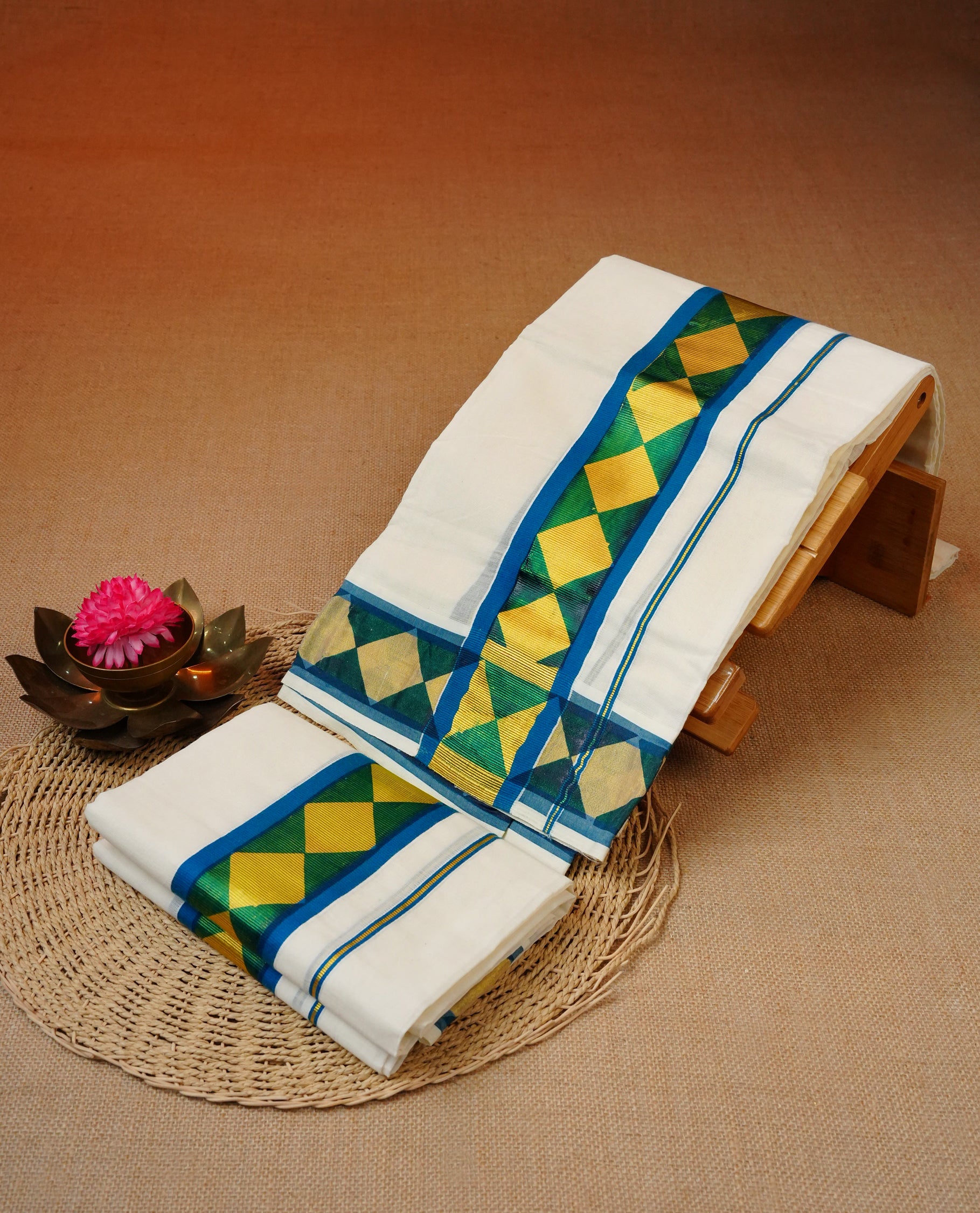 Cream colour cotton set mundu featuring Gold box pattern on blue kara .