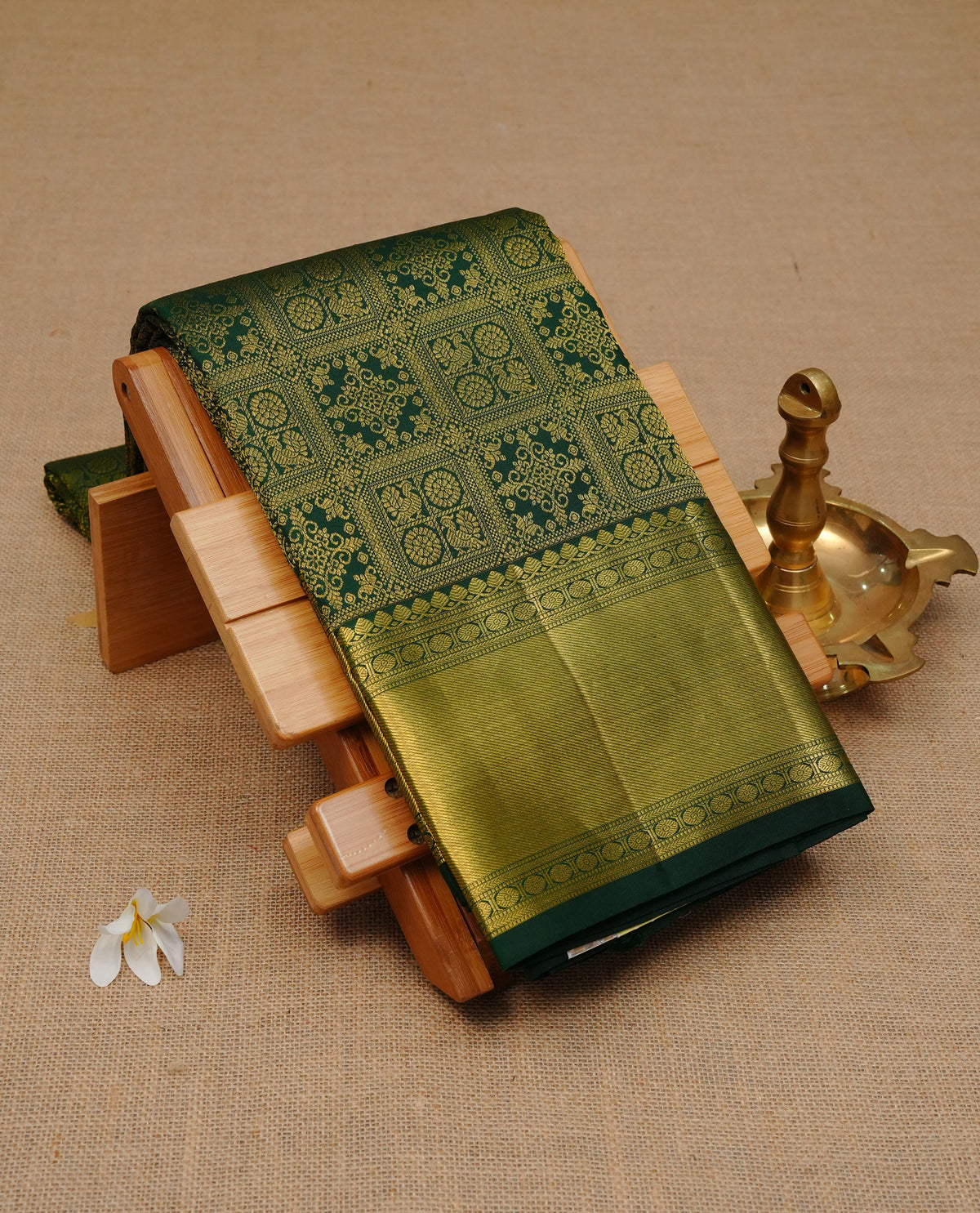 Bottle green colour Pure Wedding silk saree featuring gold zari check with designed pattern on body, complemented by self colour with traditional border, comes with matching blouse piece.