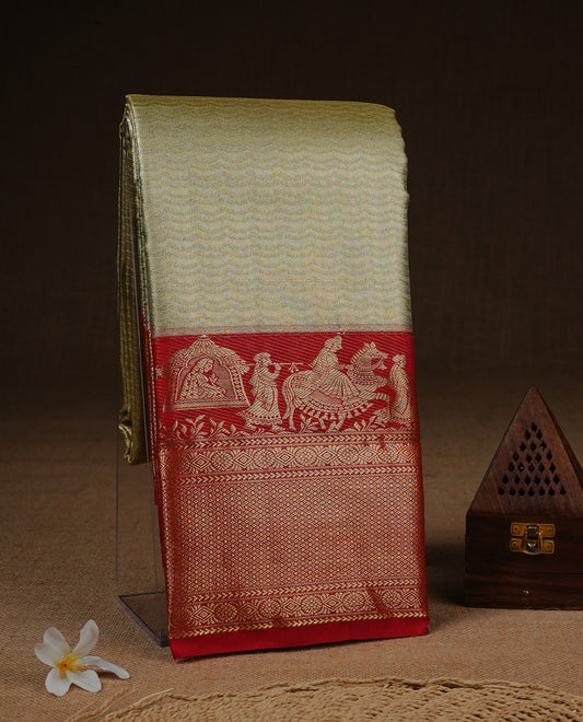 Gold colour Semi Tissue silk saree featuring silver zari pattern on body, complemented by traditional border with contrast Red colour, paired with matching blouse piece.