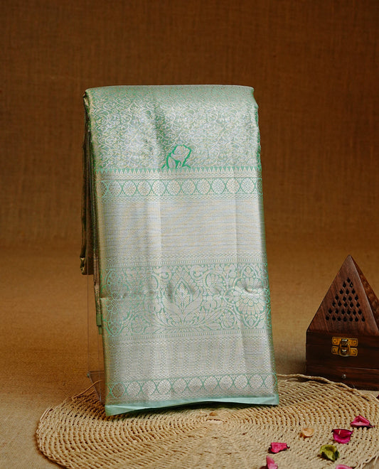 Mint & Gold Double shade Semi Tissue Silk saree featuring Light gold Kodi pattern on body, complemented by Self colour with gold zari border, paired with matching blouse piece.