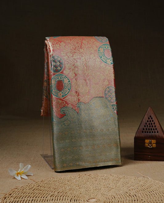 Light Pink colour Tissue silk saree featuring Gold zari Floral kodi design on body, enhance with Aqua colour with traditional zari border, paired with matching blouse piece.