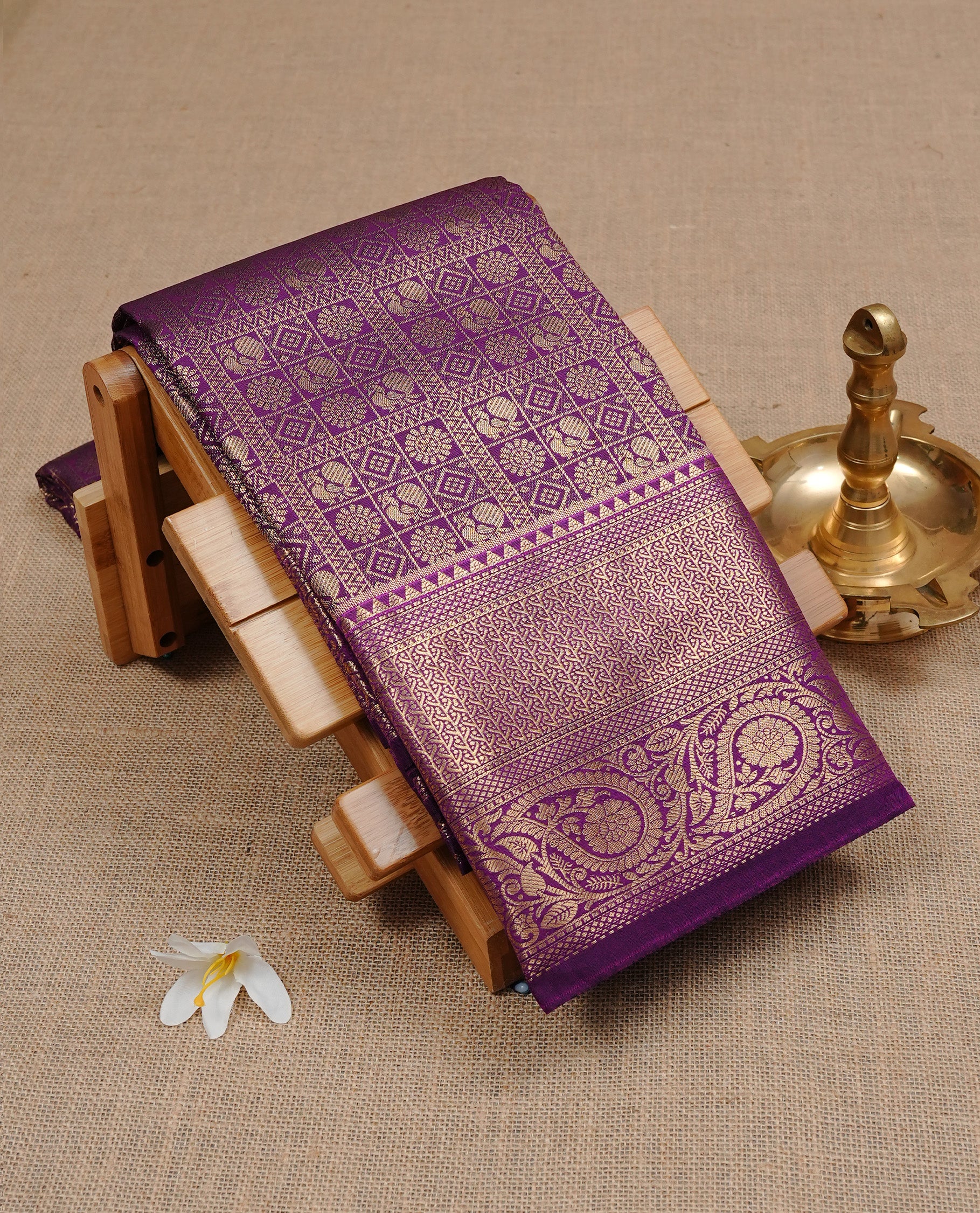 Purple Semi Wedding Silk Saree featuring Gold Zari Check with Motifs On body, Complemented with traditional zari with Self colour border, paired with matching blouse piece.