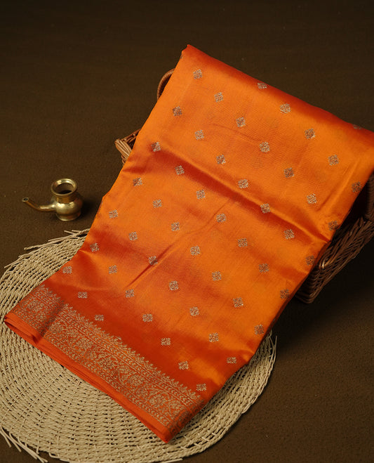 Orange colour Pure tussar Banarasi saree featuring Gold zari motifs on body, self colour gold zari border border, and a matching blouse piece.