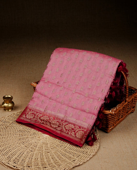 Pink colour Banaras silk saree featuring gold zari buttas on body, complemented by contrast Maroon colour border, comes with matching blouse piece.