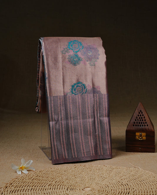 Rose Gold colour Tissue silk saree featuring Green colour floral zari motifs on body, complemented by contrast Light purple zari border, paired with matching blouse piece.