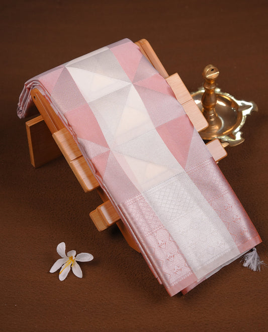 Peach & cream colour semi soft silk saree featuring a silver zari patterned body, complemented by silver zari motifes on pallu & border and a matching blouse piece.