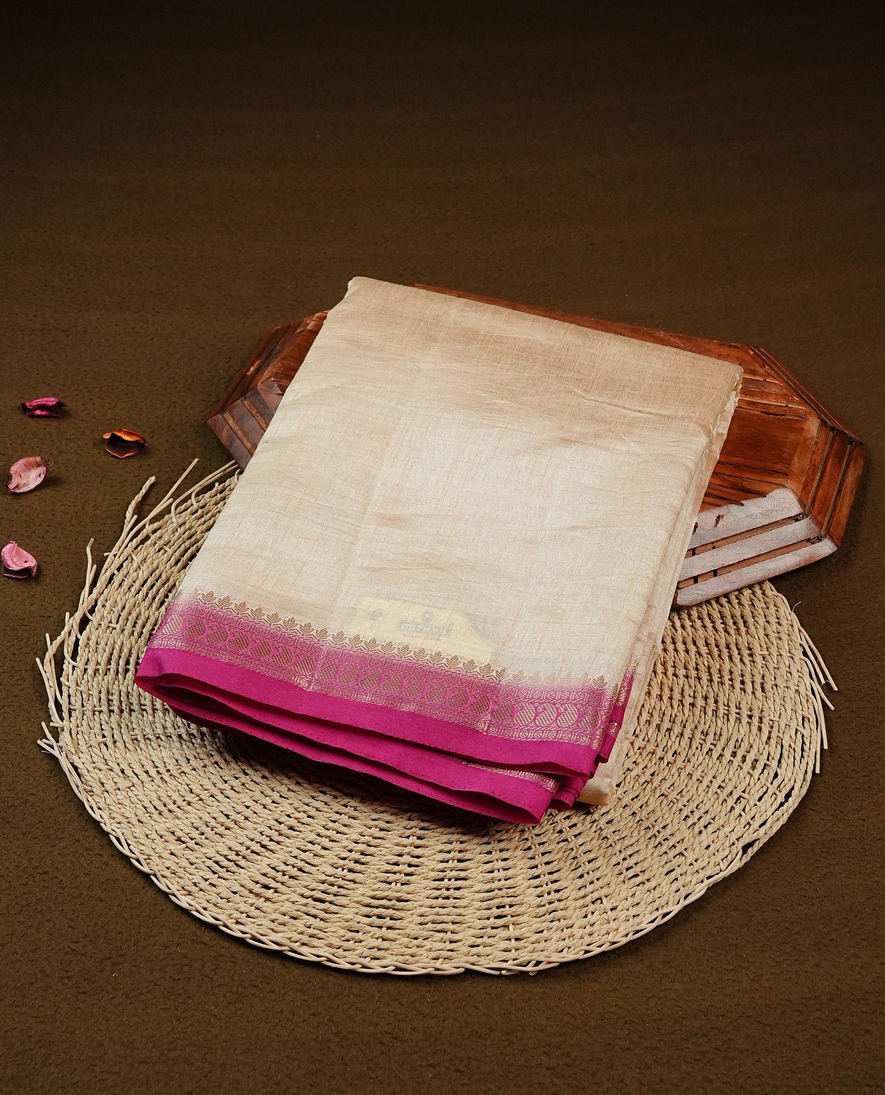 Light gold Colour Tussar saree featuring elegant plain body, complemented by contrast magenta colour with Mango zari work border, comes with matching blouse piece.