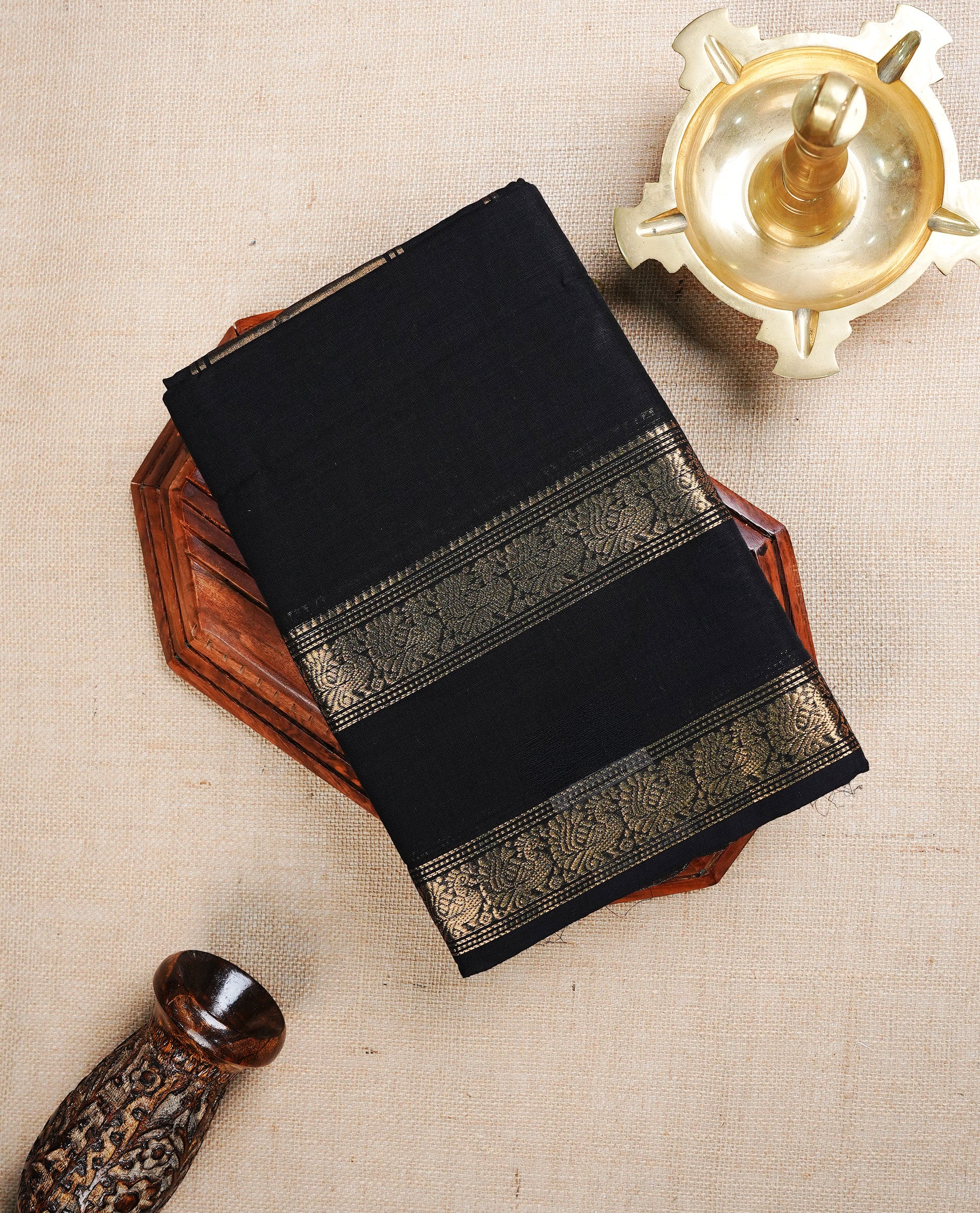 Black  colour chettinad cotton saree featuring A  Plain  body, complemented by Contrast  Colour With Peacock Gold Zari border, paired with matching blouse piece.