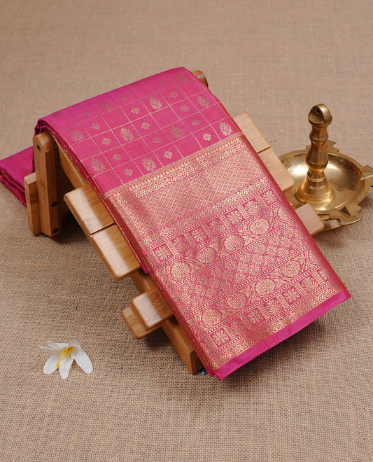 Magenta Semi Wedding Silk Saree featuring Gold Zari Check with Motifs On body, Complemented with traditional zari with Self colour border, paired with matching blouse piece.