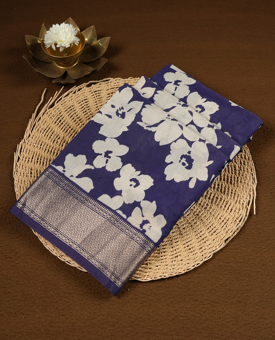 Navy blue colour Viscos semi printed saree featuring a light golden zari border, abstract Off white printed motifs on the body, and comes with a matching blouse