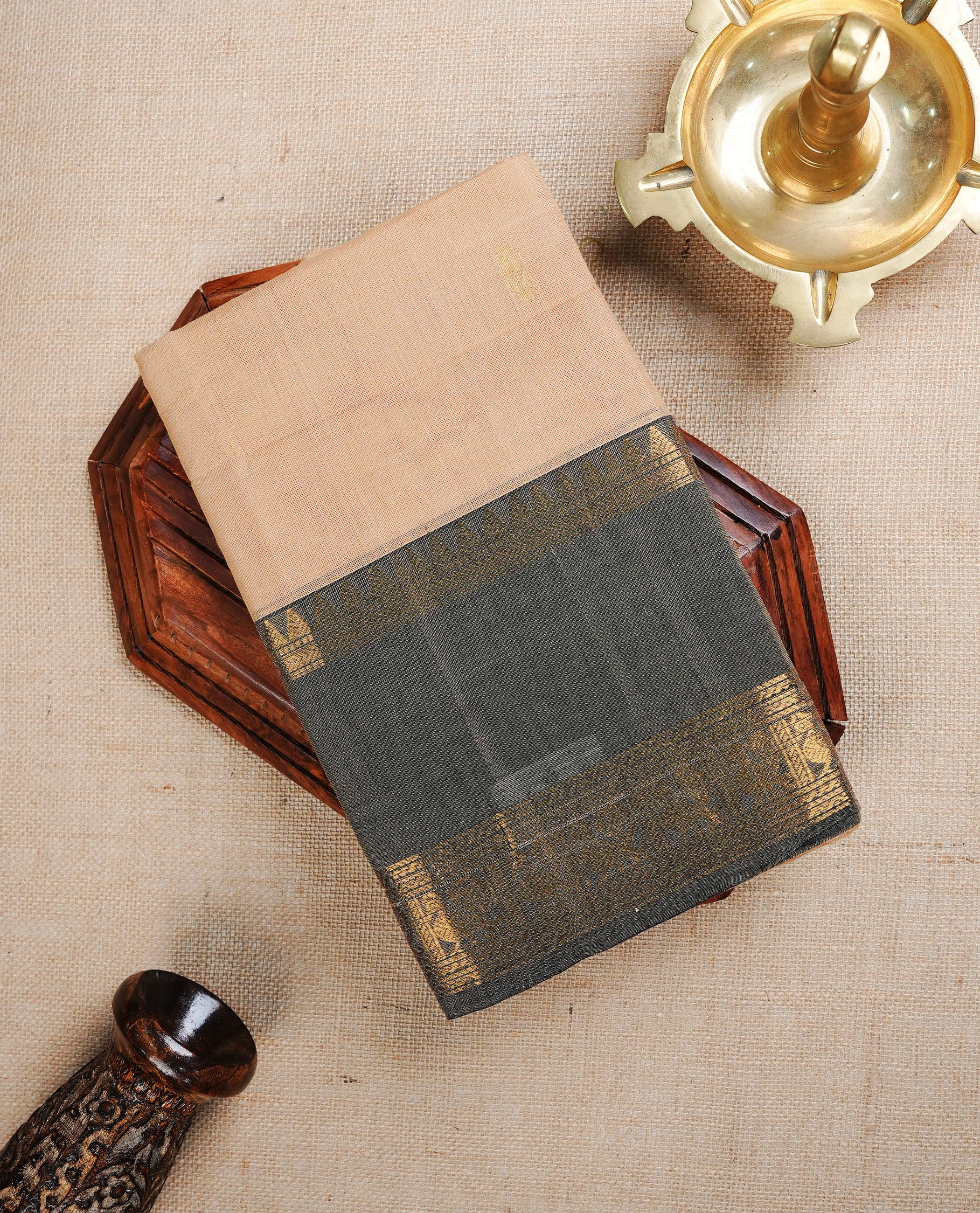 Cream colour chettinad cotton saree featuring Gold zari motifs on body, complemented by Grey with gold zari border, paired with matching blouse piece.