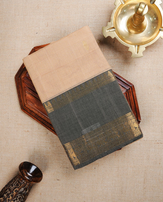 Cream colour chettinad cotton saree featuring Gold zari motifs on body, complemented by Grey with gold zari border, paired with matching blouse piece.