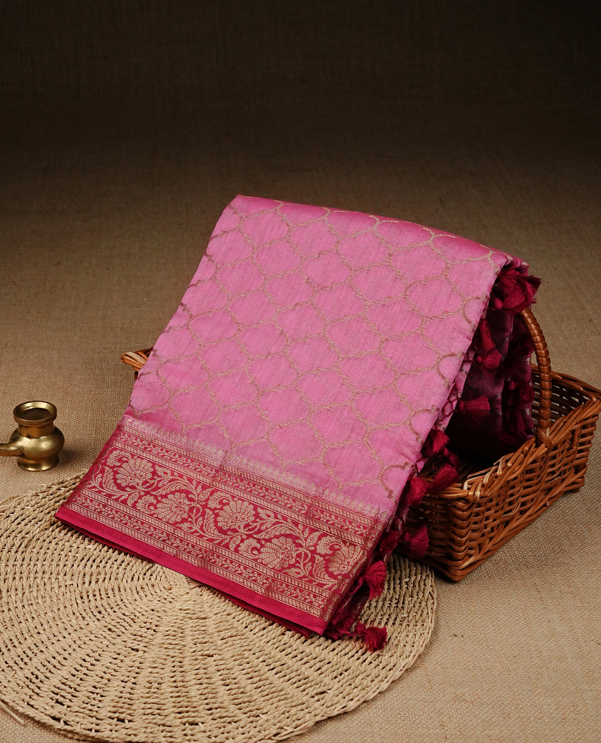 Pink colour Banaras silk saree featuring gold zari Geometric pattern on body, complemented by contrast Magenta colour with zari border, comes with matching blouse piece.