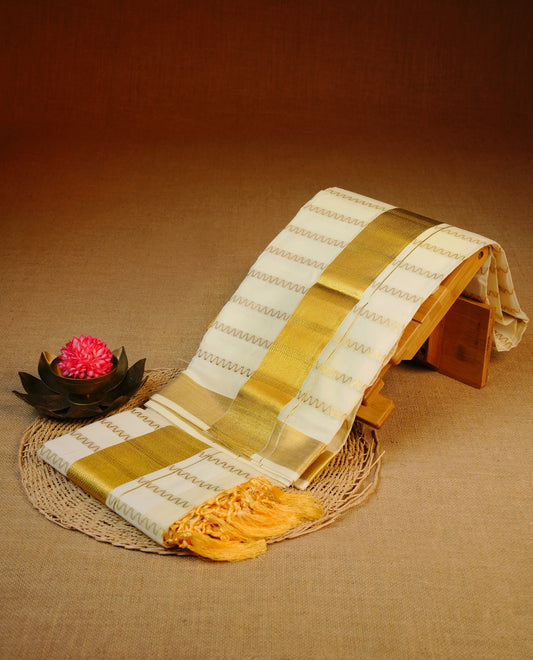 Cream colour cotton set mundu featuring gold zari zigzag strips on body, gold kasav kara.