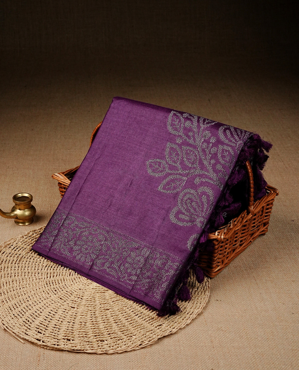 Purple colour banaras saree featuring Antique zari kodi pattern on body, complemented by Zari pattern on self colour border, comes with matching blouse piece.