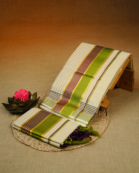 Cream Colour tissue set mundu featuring a striped body, complemented by a vibrant green and purple kara with elegant gold zar kara