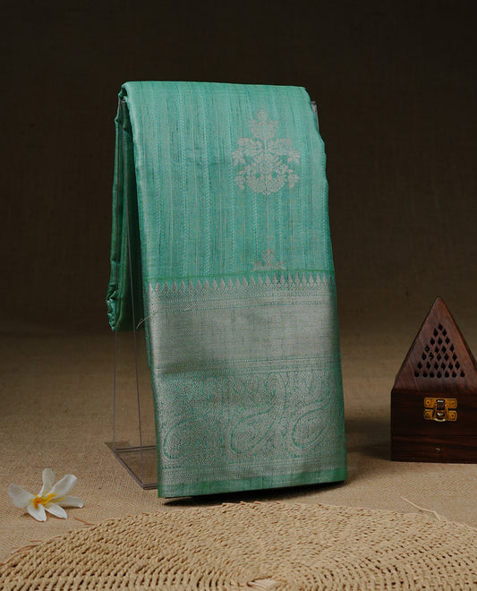 Aqua Green colour Tissue saree featuring Light gold Stripes With motifs on body, enhanced with self colour with traditional border, paired with matching blouse piece.