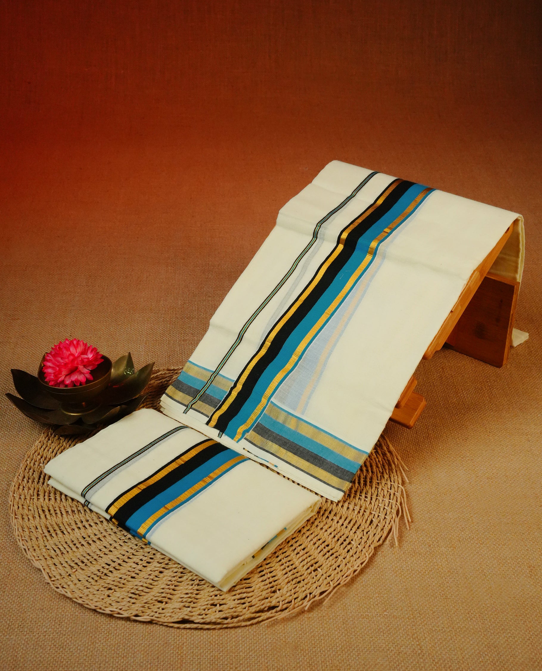 Cream colour cotton Set Mundu With Plain body, enhanced with Gold kasavu with blue & black kara.