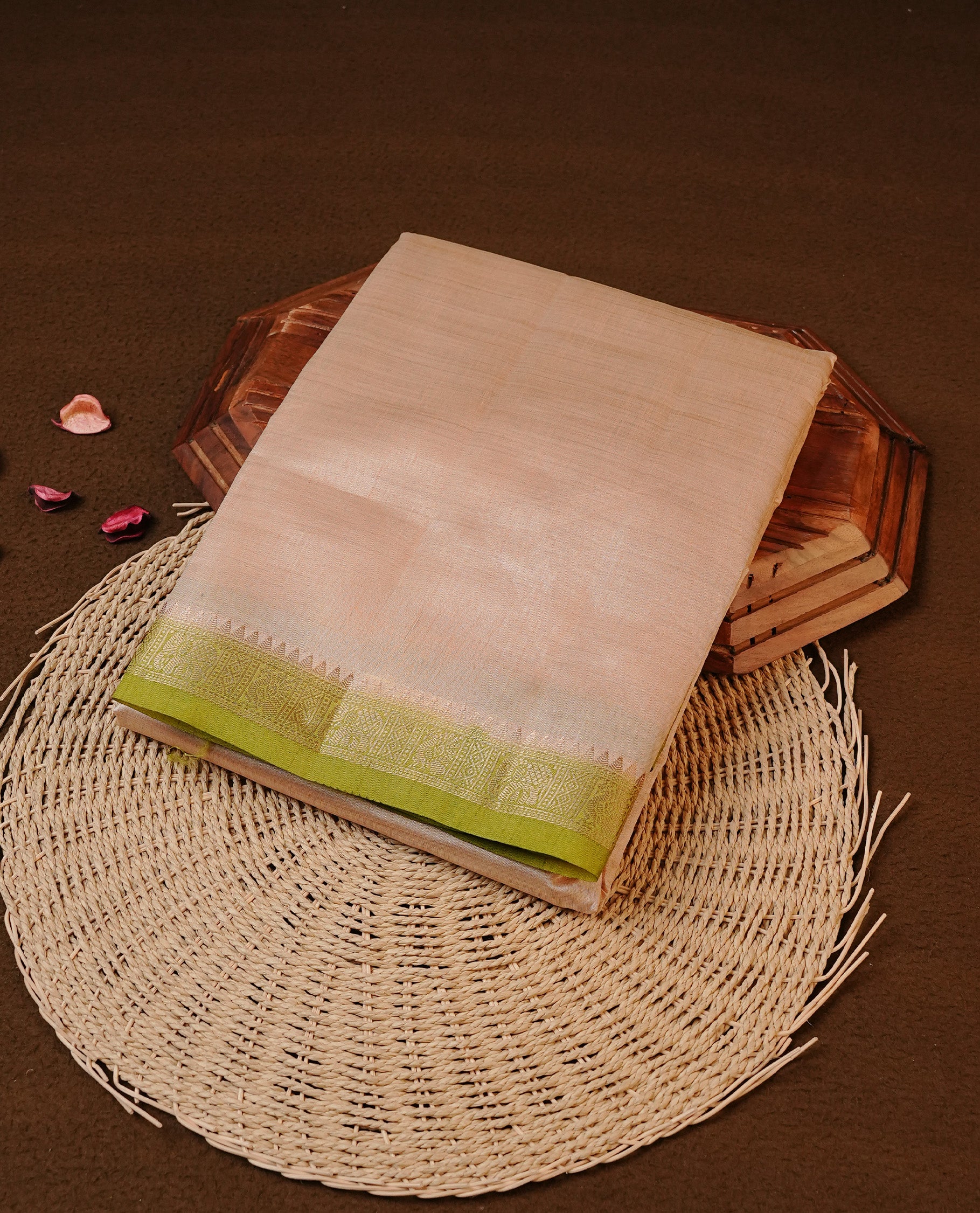 Cream colour Tussar silk saree Featuring Elegant Plain body, complemented by Contrast Light green colour with gold zari border, paired with matching blouse piece.