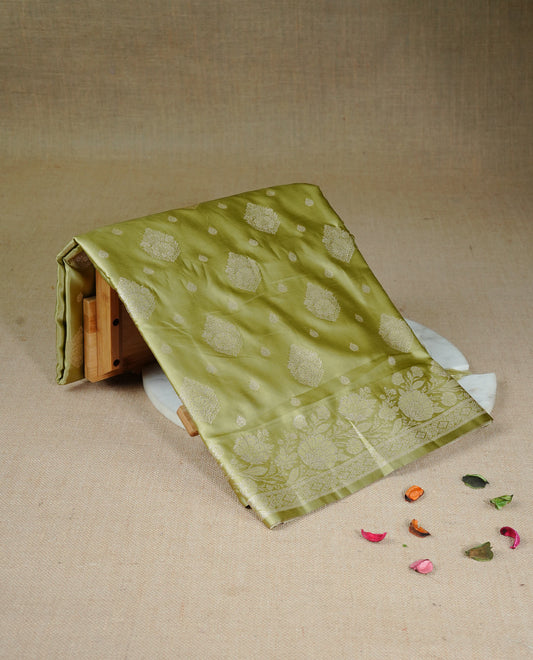 Olive colour Mulberry silk saree featuring light gold small buttas & big motifs onbody, complemented by self colour with Light gold zari floral Border, comes with matching blouse piece.