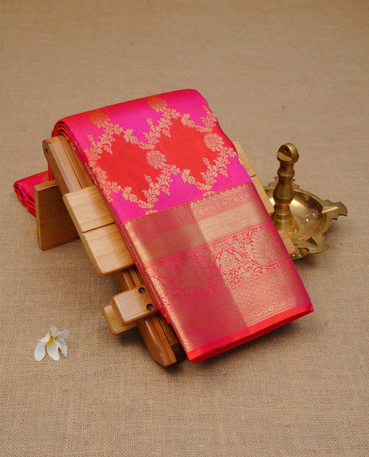 Orange & magenta colour Wedding silk saree featuring gold zari Floral kodi pattern worked body, complemented by Self colour with Traditional border, comes with matching blouse piece.
