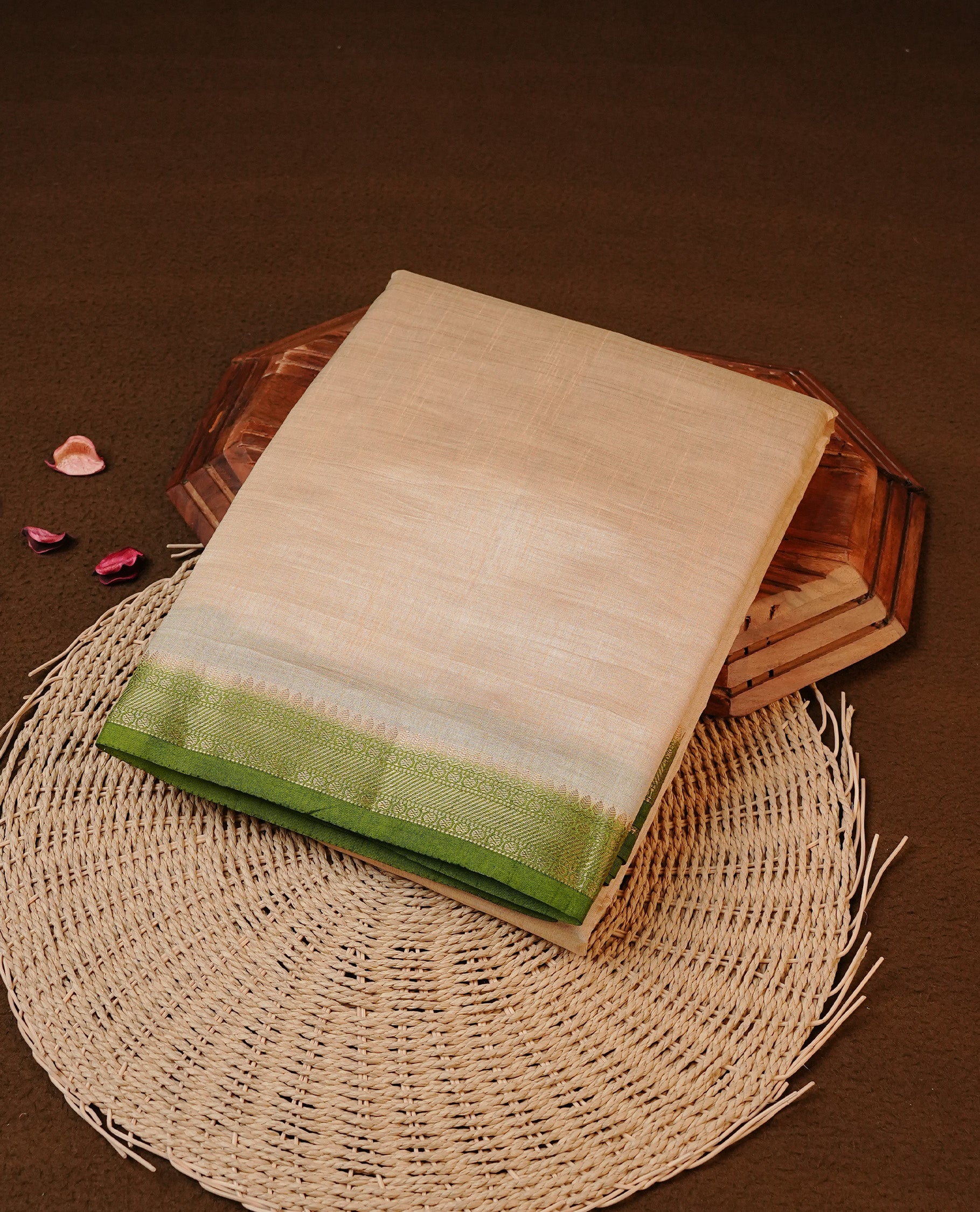 Cream colour Tussar silk saree featuirng Elegant Plain body, complemented by Contrast Light green colour with gold zari border, paired with matching blouse piece.
