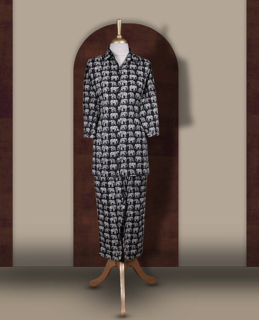 Black colour cotton coord set featuring charming elephant prints all over, Designed with a classic shirt collar and 3/4 sleeves, paired with matching straight pants for a trendy, relaxed, and comfy everyday look.