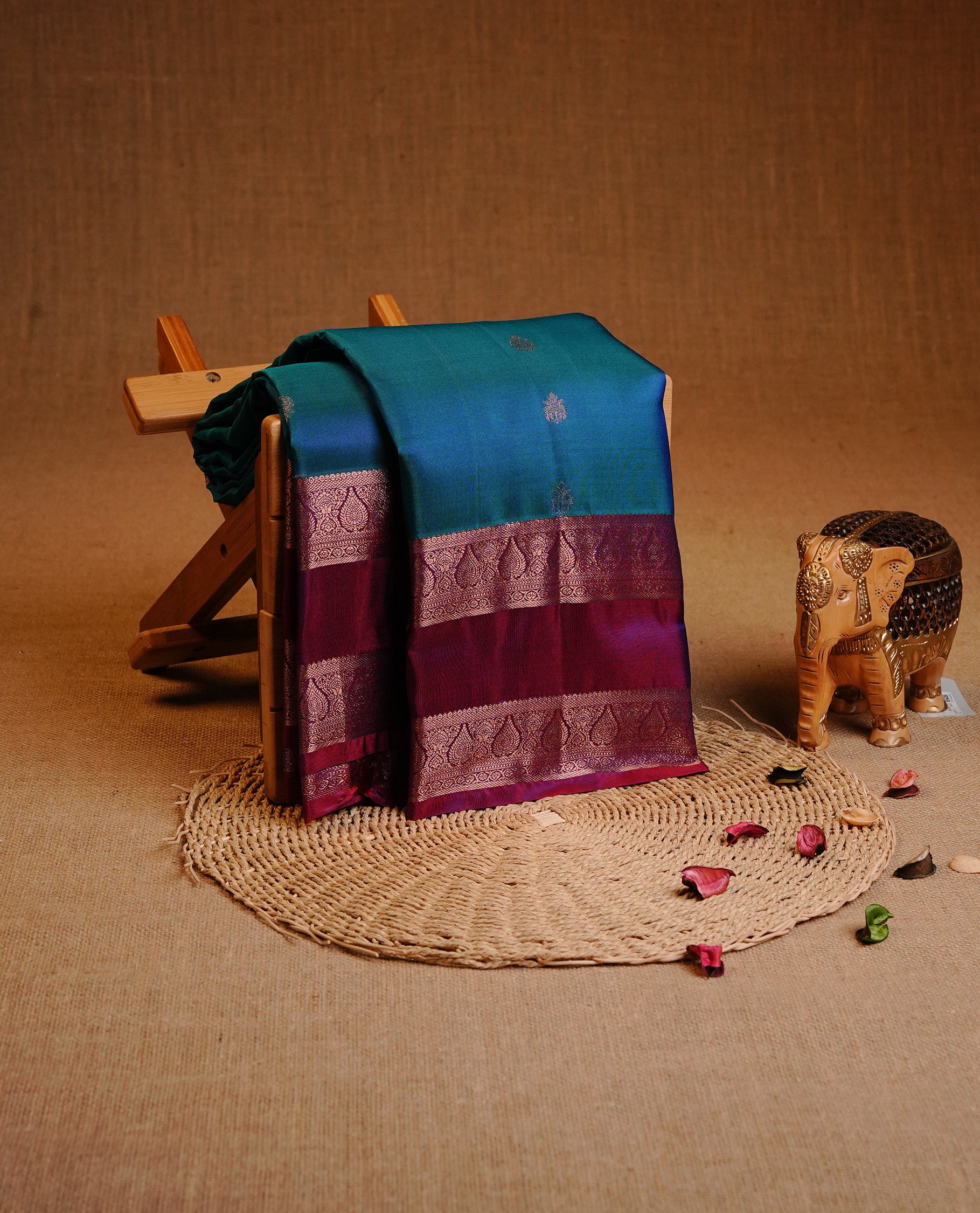 Green & Blue Dual Colour Traditional Kancheepuram Slik Saree Featuring Gold Zari Motifs on the Body, Complemented by a Contrast Purple Colour  Gold Zari Traditional Border and Pallu, Paired with a Matching Blouse .